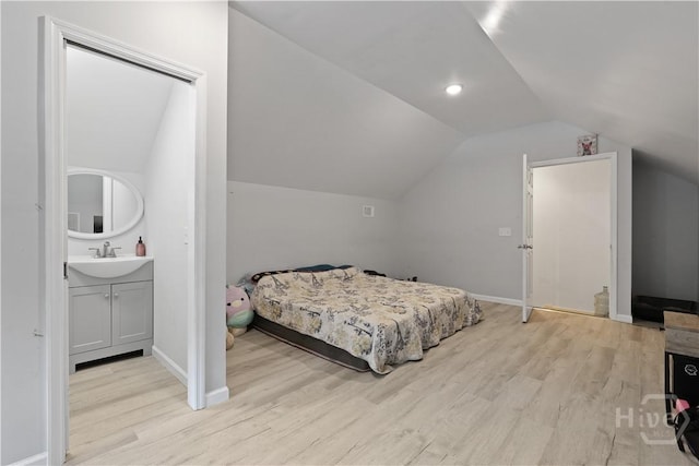 1280 Little Mccall Rd, Guyton, GA 31312 - bedroom featuring light wood-style floors, lofted ceiling, a sink, and baseboards