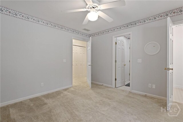 1280 Little Mccall Rd, Guyton, GA 31312 - unfurnished bedroom featuring light carpet, baseboards, and a ceiling fan