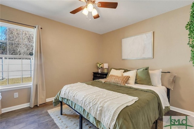 bedroom with ceiling fan and hardwood / wood-style floors