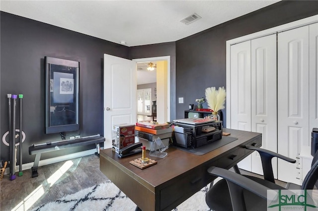 office featuring hardwood / wood-style flooring and ceiling fan