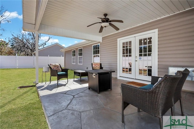 view of patio featuring ceiling fan and french doors