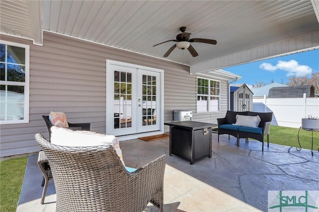 view of patio / terrace featuring french doors, ceiling fan, and an outdoor living space