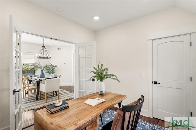 office with dark wood-type flooring, baseboards, french doors, and an inviting chandelier