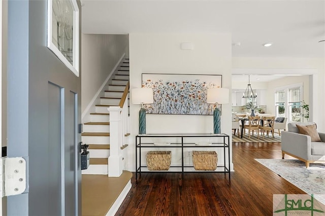 interior space with wood finished floors, recessed lighting, and stairs
