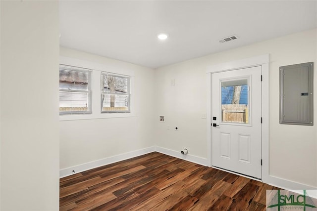 unfurnished room with recessed lighting, dark wood-style floors, visible vents, electric panel, and baseboards