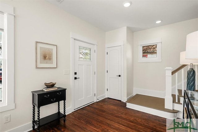 foyer entrance with recessed lighting, baseboards, stairs, and dark wood-style floors