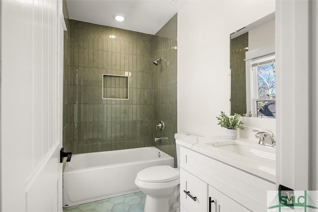 full bathroom with vanity, toilet, tiled shower / bath combo, and tile patterned flooring