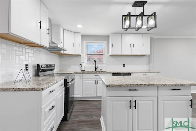 kitchen featuring hanging light fixtures, white cabinetry, sink, and electric range