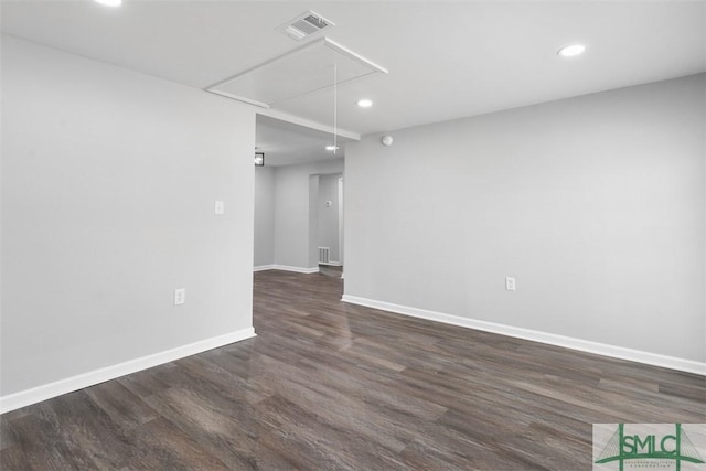 spare room featuring dark hardwood / wood-style floors