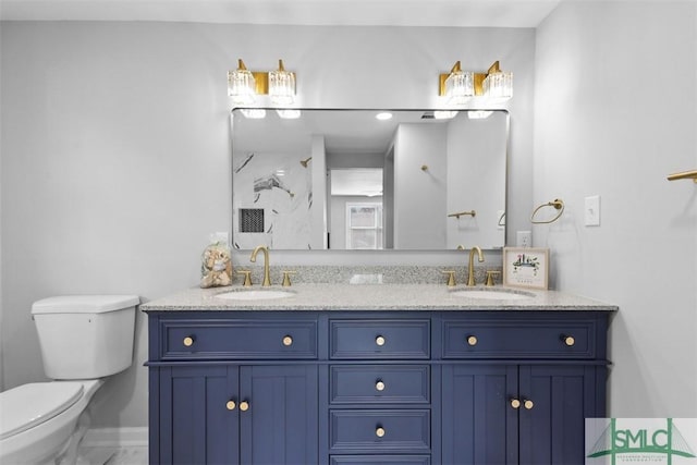 bathroom featuring walk in shower, vanity, and toilet