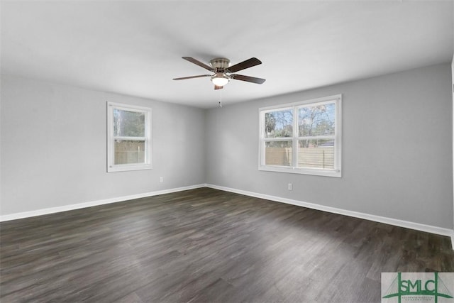 spare room with dark hardwood / wood-style floors and ceiling fan