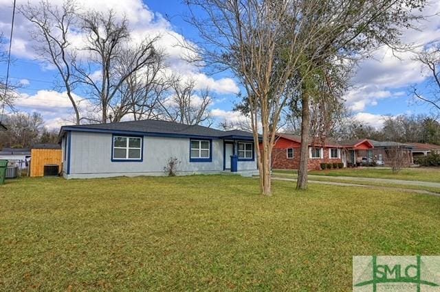 single story home featuring a front yard