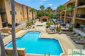 view of swimming pool with a patio