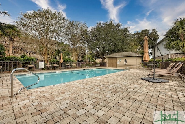 view of swimming pool with a patio area