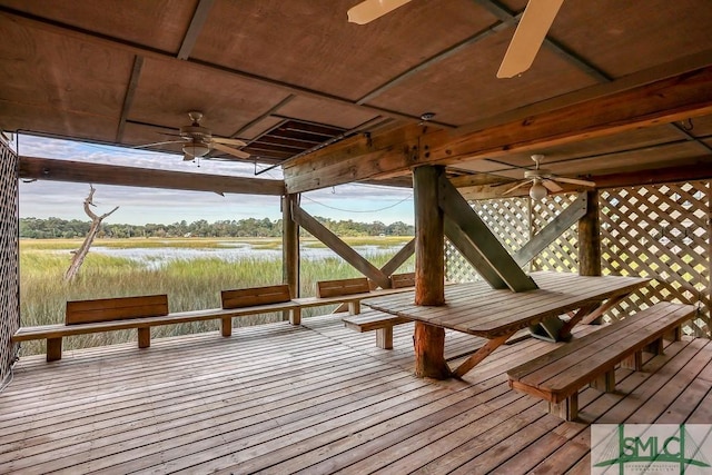 deck featuring ceiling fan and a rural view