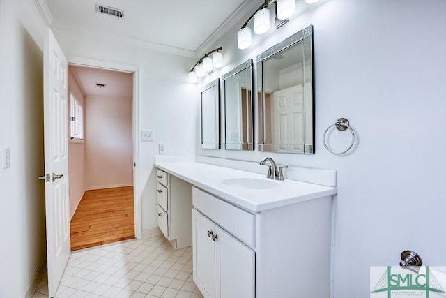 bathroom with vanity, tile patterned floors, and ornamental molding