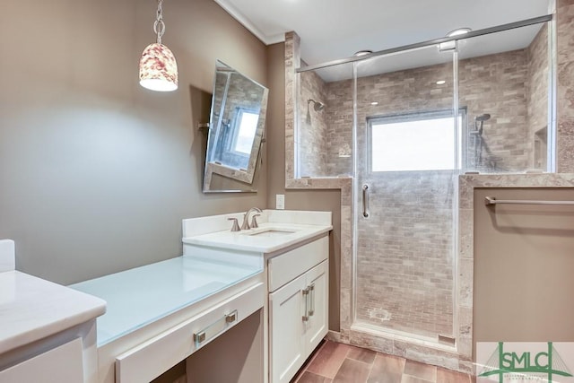 bathroom with vanity and a shower with door