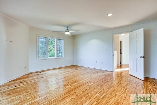 unfurnished room with crown molding, ceiling fan, and light wood-type flooring