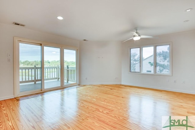 unfurnished room with ceiling fan and light hardwood / wood-style flooring