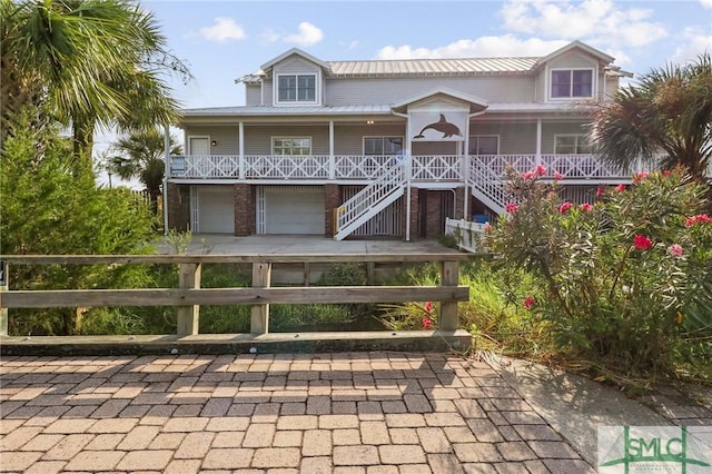 exterior space with a garage and covered porch