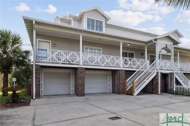 view of front of house featuring a garage and covered porch