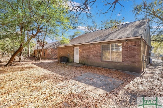 back of property with central AC unit