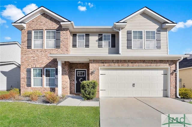 view of front of property featuring a garage and a front lawn