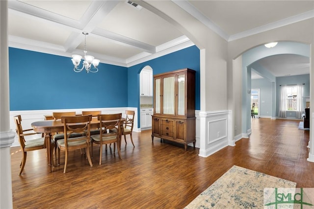 dining space featuring crown molding, an inviting chandelier, beam ceiling, coffered ceiling, and dark hardwood / wood-style flooring