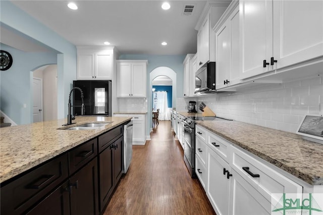 kitchen featuring white cabinetry, sink, black appliances, and dark brown cabinetry