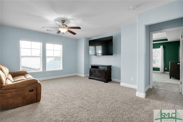 living room with light carpet and ceiling fan