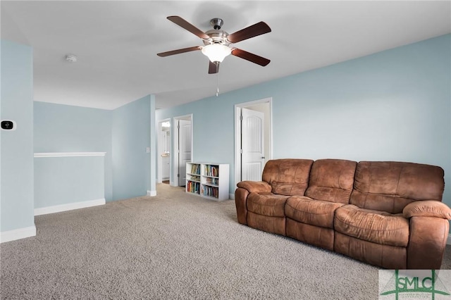 carpeted living room with ceiling fan