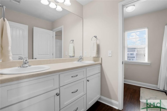 bathroom with vanity and hardwood / wood-style floors