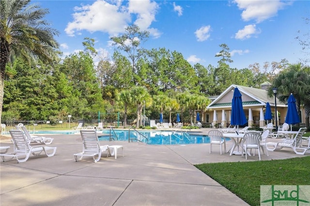 view of swimming pool featuring a patio area