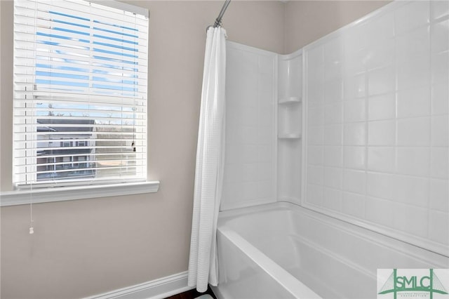 bathroom featuring shower / tub combo