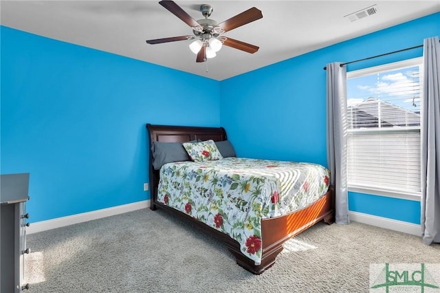 bedroom with ceiling fan and carpet