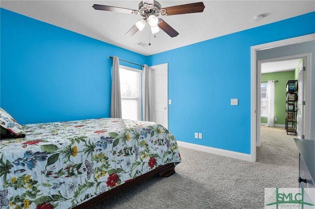 carpeted bedroom with ceiling fan