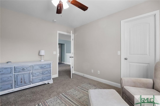 living area with ceiling fan and light colored carpet