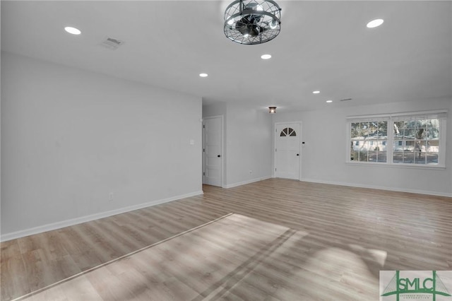 unfurnished living room with light wood-type flooring