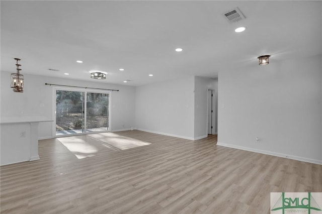 unfurnished living room with light wood-type flooring