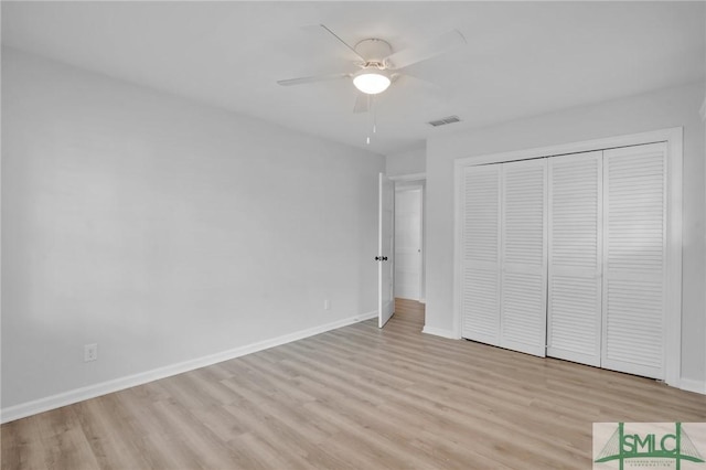 unfurnished bedroom featuring a closet, ceiling fan, and light hardwood / wood-style flooring