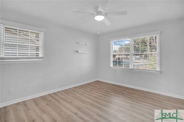 empty room with light hardwood / wood-style flooring and ceiling fan