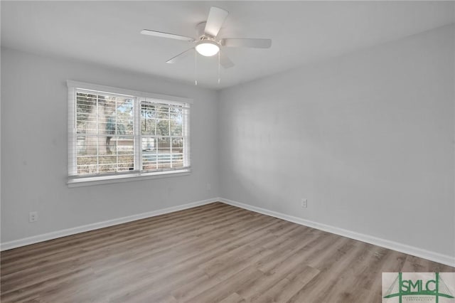 unfurnished room with ceiling fan and light hardwood / wood-style floors