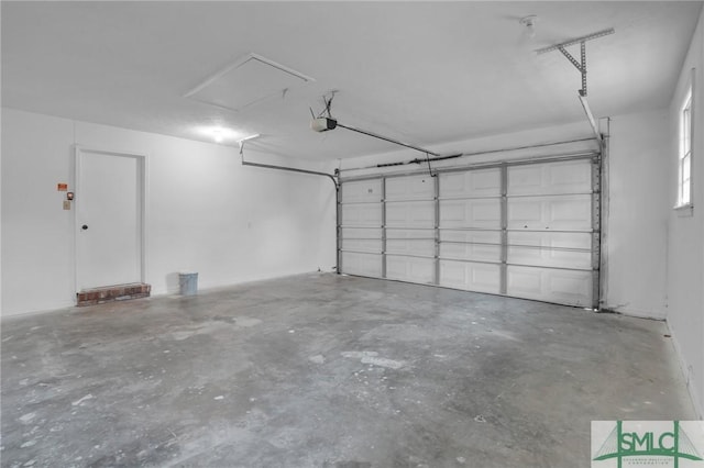 garage featuring a garage door opener