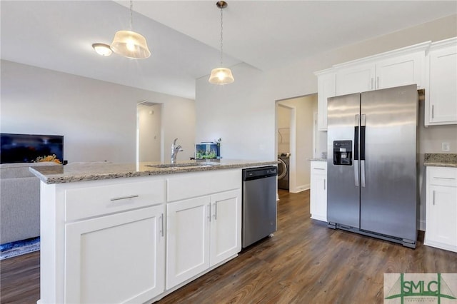 kitchen with white cabinetry, sink, hanging light fixtures, and appliances with stainless steel finishes