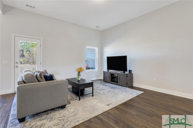 living room with dark hardwood / wood-style floors