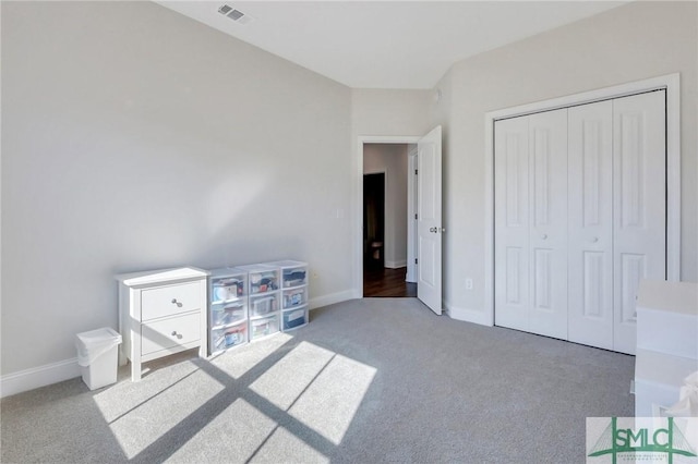 carpeted bedroom with a closet