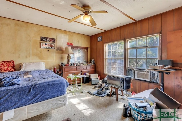 bedroom with cooling unit and wooden walls