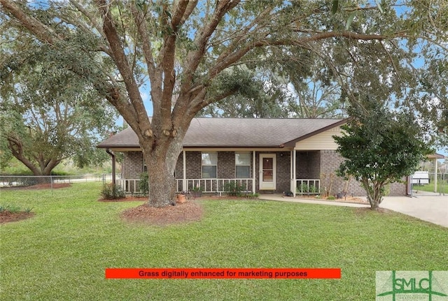 view of front facade with a front yard and covered porch