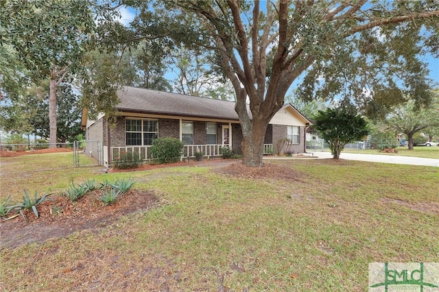 ranch-style home with a porch and a front lawn