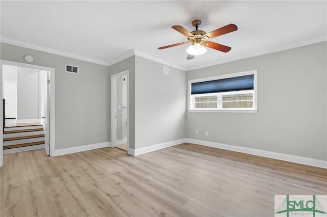 interior space with crown molding, ceiling fan, and light wood-type flooring